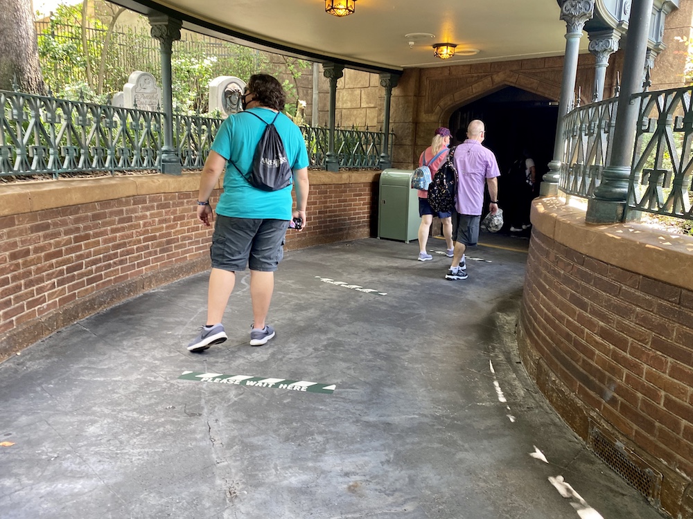 Social distancing markers in the Haunted Mansion queue