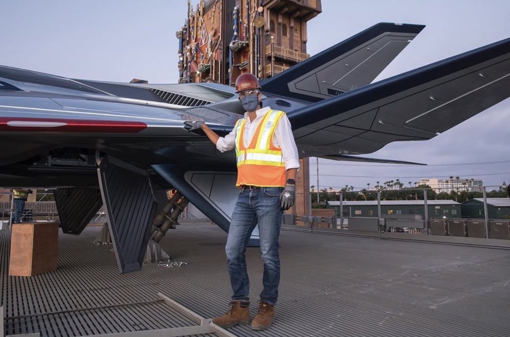 Disney Parks Chairman Josh D’Amaro with the Quinjet in Avengers Campus