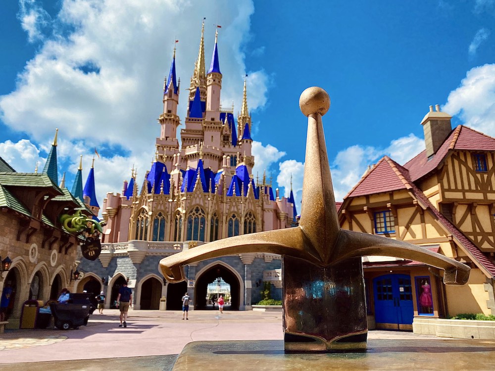 The Sword in the Stone gleams in front of Cinderella Castle