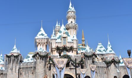 Holiday lights and snow on the Sleeping Beauty Castle at Disneyland