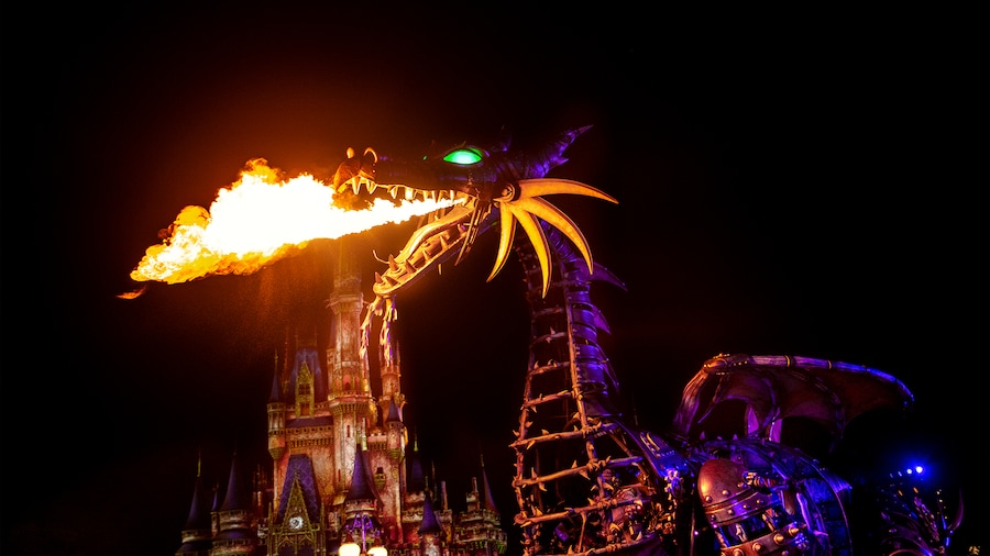 Maleficent Dragon breathing fire at night in Magic Kingdom